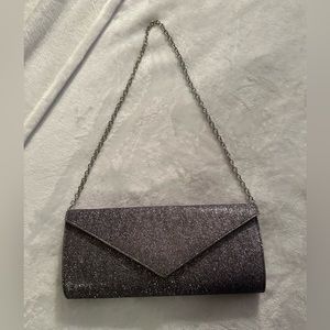 Silver glitter clutch. Great condition. Silver chain